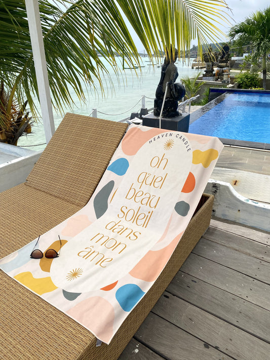 Serviette de plage avec citation "Oh quel beau soleil dans mon âme."