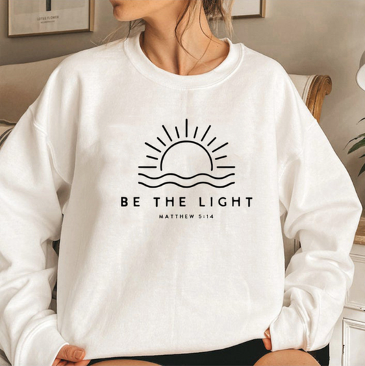 SWEAT avec citation "Be the light" blanc
